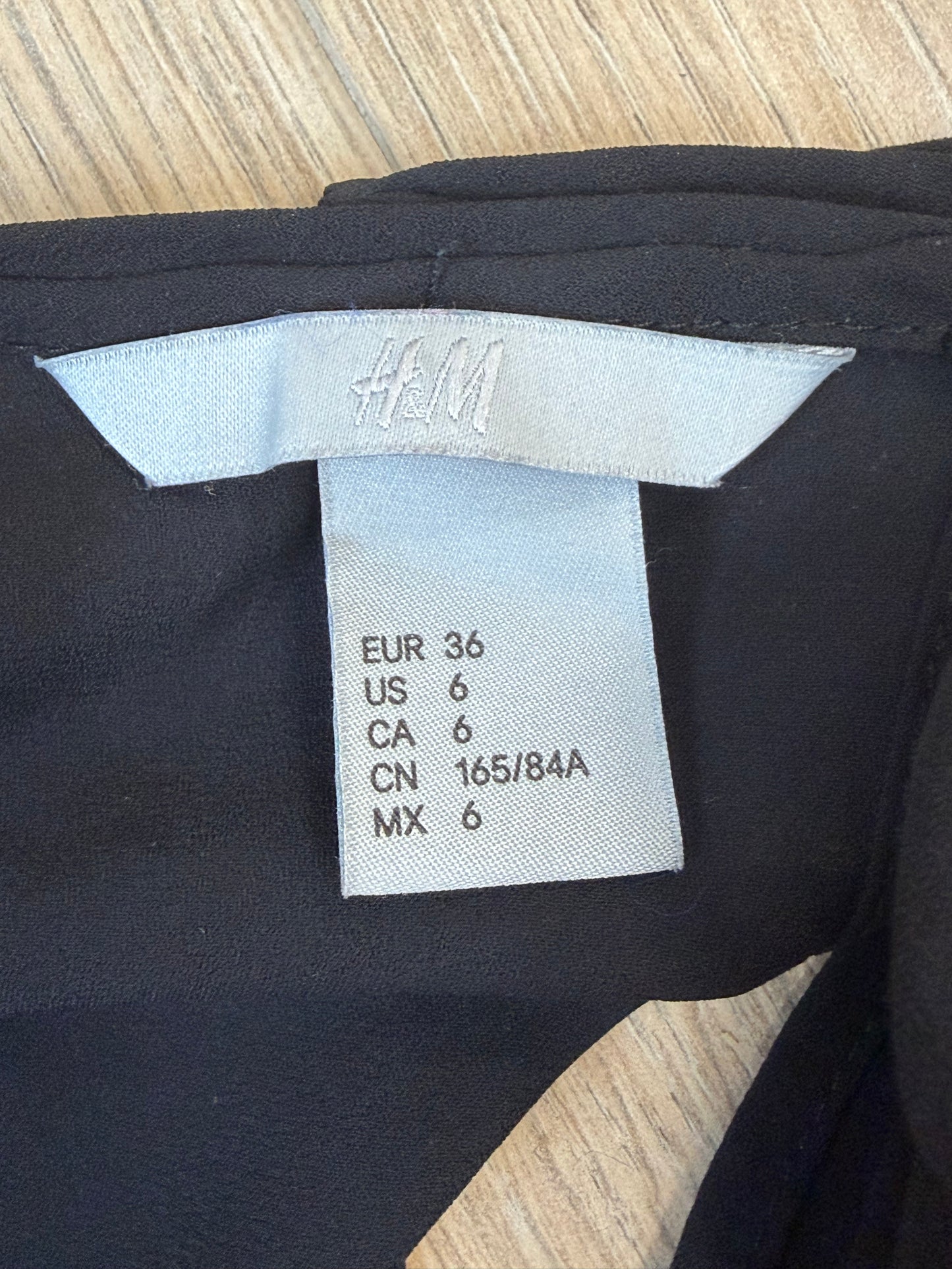 Débardeur noir H&M femme fluide sans manches taille 36